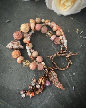 agate carved quartz, Czech glass bird, rhodochrosite stones, strawberry quartz and moonstone, Copper metal, bracelet.