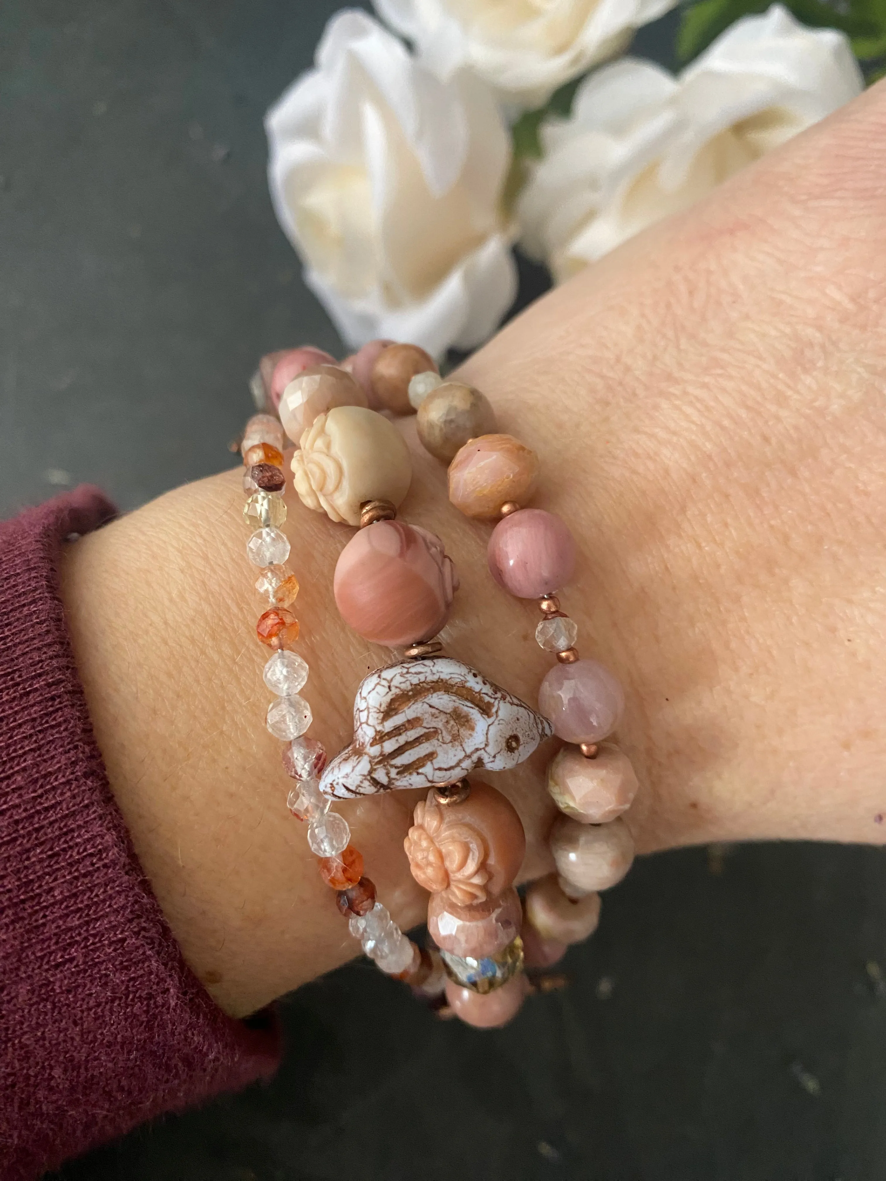 agate carved quartz, Czech glass bird, rhodochrosite stones, strawberry quartz and moonstone, Copper metal, bracelet.